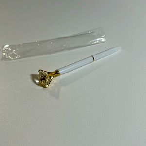Ink pen with crystal ring.
